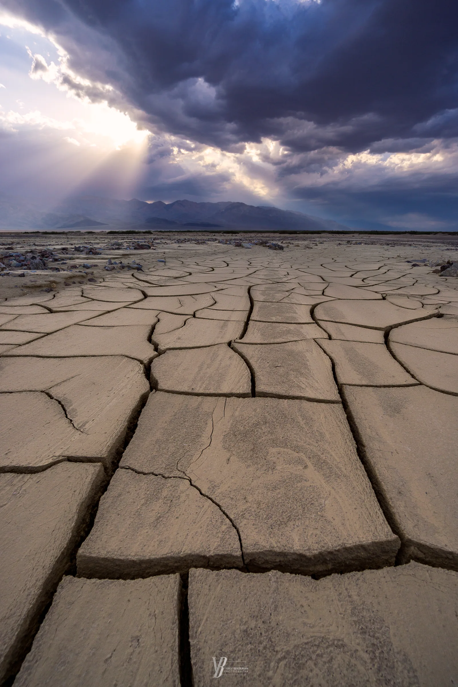 Cracked Earth, Crepuscular Light, photograph by Yaniv Bekerman